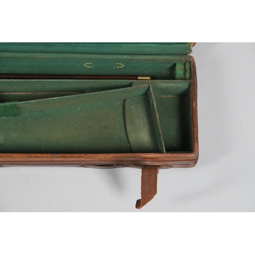 46 - A LEATHER TRAVELLING CASE FOR A SHOTGUN. A leather gun case with label for Boss & Co, London. Case 8... 