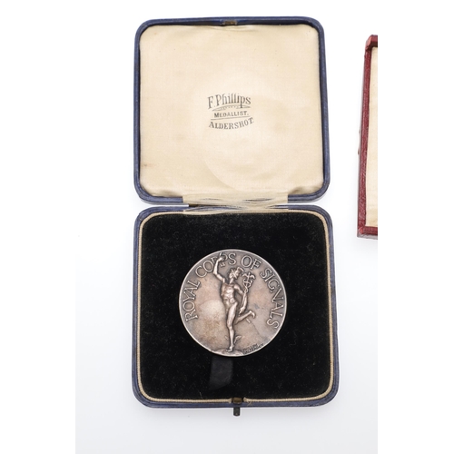 475 - A SILVER PRESENTATION MEDAL FROM THE CONFECTIONERS AND BAKERS EXHIBITION AND TWO OTHERS. A silver aw... 