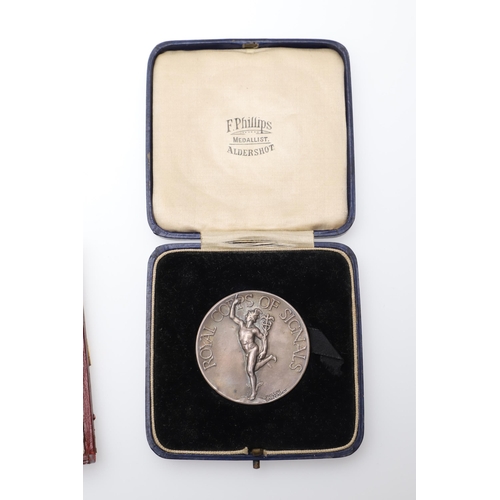 475 - A SILVER PRESENTATION MEDAL FROM THE CONFECTIONERS AND BAKERS EXHIBITION AND TWO OTHERS. A silver aw... 