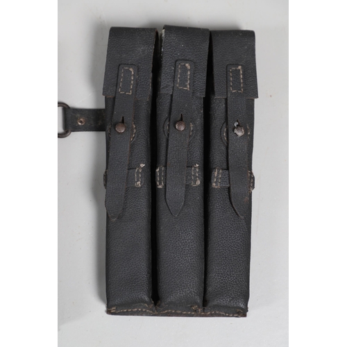 50 - TWO SECOND WORLD WAR GERMAN MACHINE GUN MAGAZINE POUCHES AND MAGAZINES. Two black leather magazine p... 