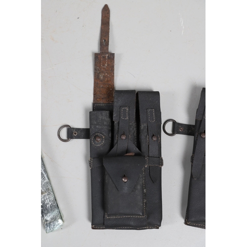 50 - TWO SECOND WORLD WAR GERMAN MACHINE GUN MAGAZINE POUCHES AND MAGAZINES. Two black leather magazine p... 