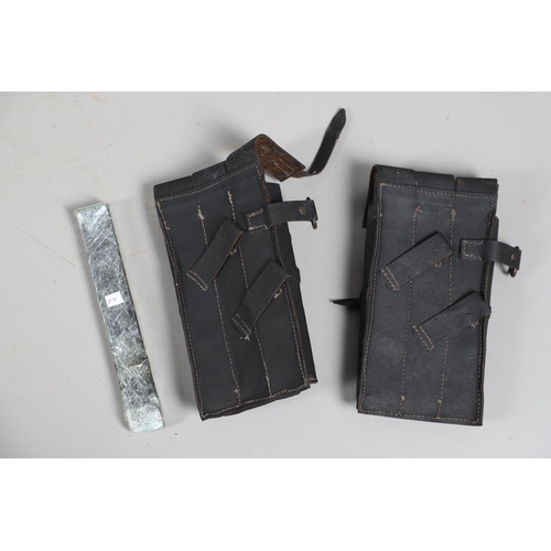 50 - TWO SECOND WORLD WAR GERMAN MACHINE GUN MAGAZINE POUCHES AND MAGAZINES. Two black leather magazine p... 