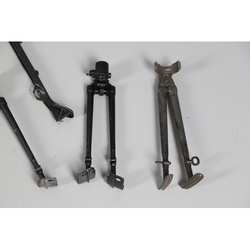 54 - A MILITARY MACHINE GUN TRIPOD AND A COLLECTION OF SMALLER BARREL SUPPORTS. A large three legged khak... 