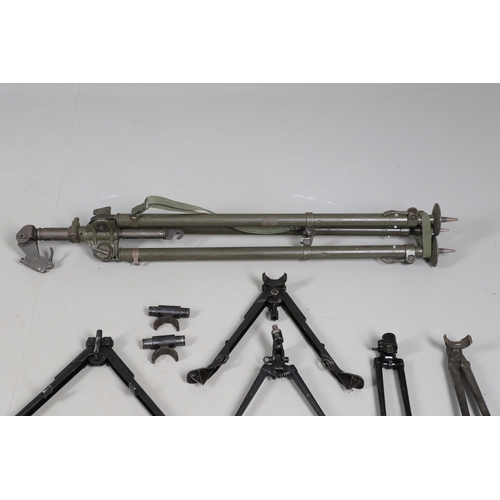 54 - A MILITARY MACHINE GUN TRIPOD AND A COLLECTION OF SMALLER BARREL SUPPORTS. A large three legged khak... 