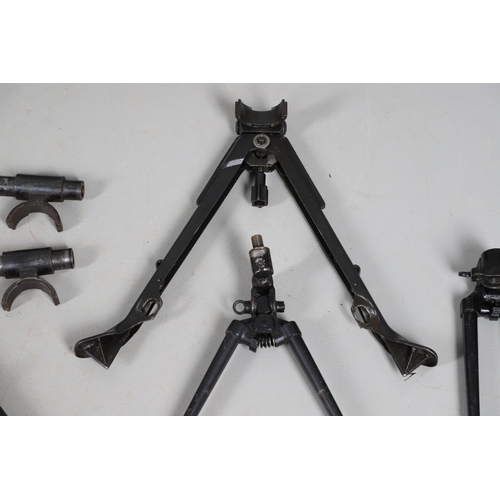 54 - A MILITARY MACHINE GUN TRIPOD AND A COLLECTION OF SMALLER BARREL SUPPORTS. A large three legged khak... 