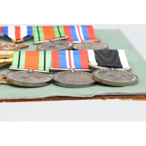 555 - THREE BARS OF SECOND WORLD WAR MEDALS TO INCLUDE A NEW ZEALAND WAR SERVICE GROUP. A group of five co... 