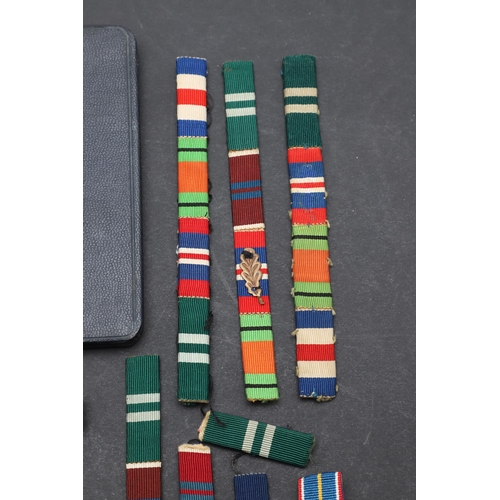 558 - A TERRITORIAL EFFICIENCY MEDAL, A SET OF MINIATURES AND RIBBON BARS. An Elizabeth II Territorial Eff... 