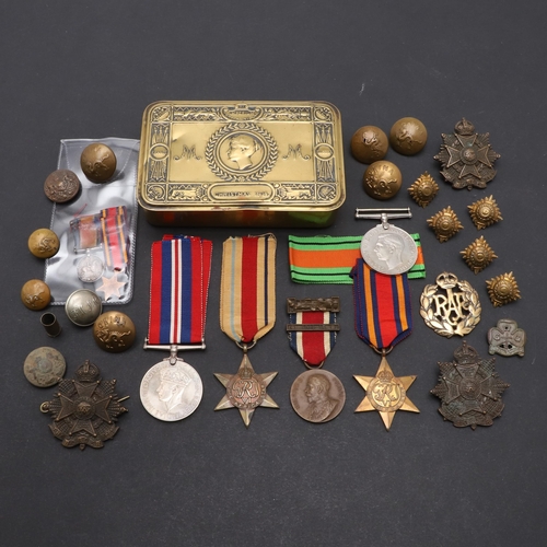 559 - A 1914 CHRISTMAS TIN, SECOND WORLD WAR MEDALS AND A SMALL COLLECTION OF BADGES AND BUTTONS. A First ... 