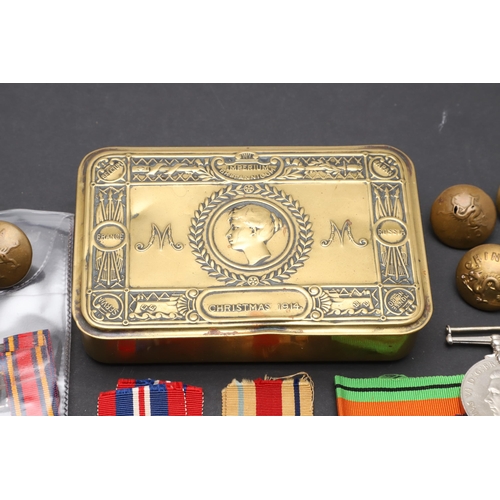 559 - A 1914 CHRISTMAS TIN, SECOND WORLD WAR MEDALS AND A SMALL COLLECTION OF BADGES AND BUTTONS. A First ... 