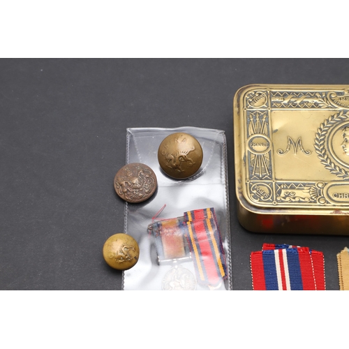 559 - A 1914 CHRISTMAS TIN, SECOND WORLD WAR MEDALS AND A SMALL COLLECTION OF BADGES AND BUTTONS. A First ... 