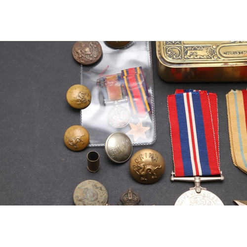 559 - A 1914 CHRISTMAS TIN, SECOND WORLD WAR MEDALS AND A SMALL COLLECTION OF BADGES AND BUTTONS. A First ... 