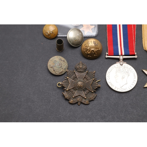 559 - A 1914 CHRISTMAS TIN, SECOND WORLD WAR MEDALS AND A SMALL COLLECTION OF BADGES AND BUTTONS. A First ... 