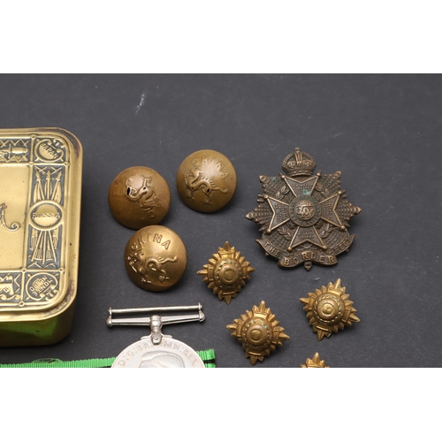 559 - A 1914 CHRISTMAS TIN, SECOND WORLD WAR MEDALS AND A SMALL COLLECTION OF BADGES AND BUTTONS. A First ... 