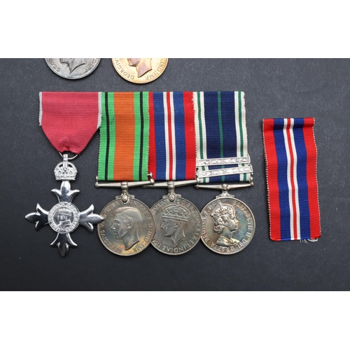 562 - A COLLECTION OF MEDALS TO THE HOGG FAMILY AND OTHERS TO INCLUDE AN MBE GROUP OF FOUR. A group of fou... 