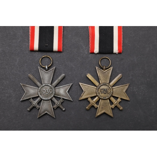 573 - TWO SECOND WORLD WAR GERMAN WAR SERVICE CROSSES. Two German War Service Crosses, 2nd Class with swor... 