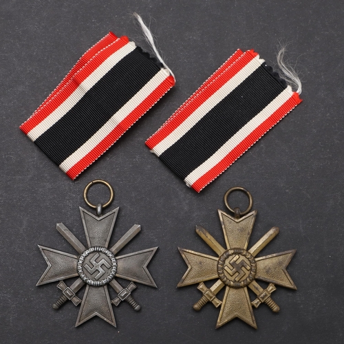 573 - TWO SECOND WORLD WAR GERMAN WAR SERVICE CROSSES. Two German War Service Crosses, 2nd Class with swor... 