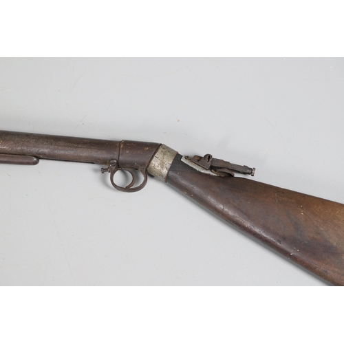 58 - AN EARLY BSA IMPROVED MODEL D 0.177 AIR RIFLE. The 49 cm barrel numbered 27143 with under lever cock... 