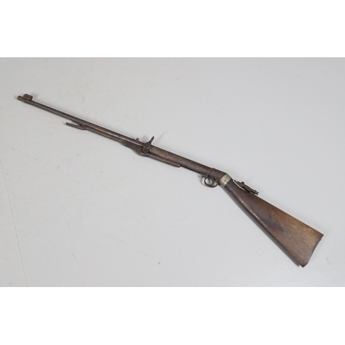 58 - AN EARLY BSA IMPROVED MODEL D 0.177 AIR RIFLE. The 49 cm barrel numbered 27143 with under lever cock... 