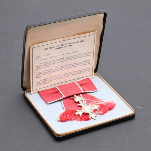 585 - A LADIES MBE IN FITTED CASE. A ladies MBE breast badge on second type civilian bow, in fitted case o... 