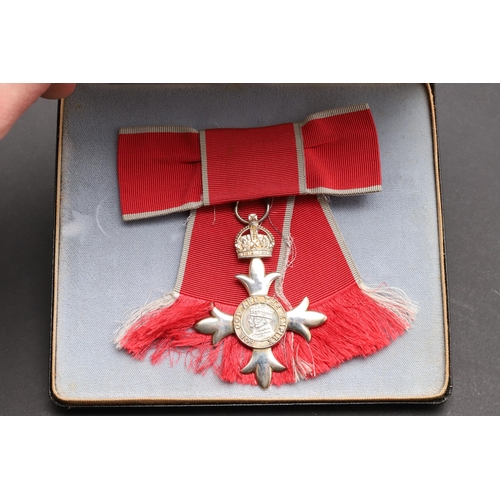 585 - A LADIES MBE IN FITTED CASE. A ladies MBE breast badge on second type civilian bow, in fitted case o... 