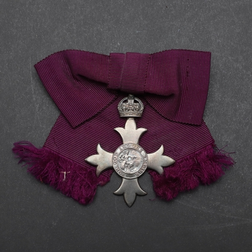 586 - A GEORGE V M.B.E. LADIES AWARD. An MBE on first type civilian bow type ribbon, hallmarked for London... 