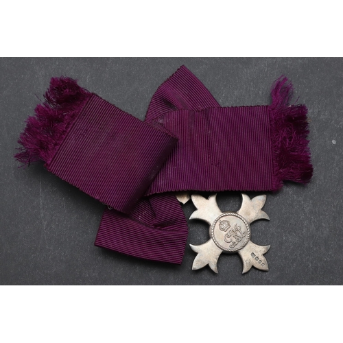 586 - A GEORGE V M.B.E. LADIES AWARD. An MBE on first type civilian bow type ribbon, hallmarked for London... 