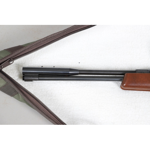 62 - A WEIHRAUCH HW 97K .22 AIR RIFLE AND TRAVELLING CASE. A Weihrauch HW 97K .22 air rifle number 189297... 