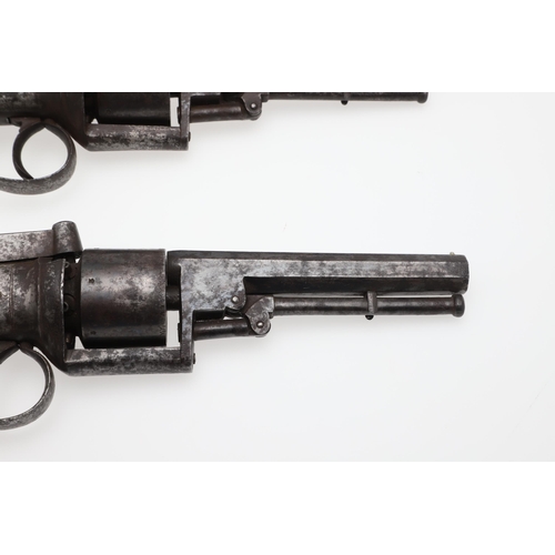 7 - AN UNUSUAL PAIR OF MID 19TH CENTURY 80 BORE TRANSITIONAL REVOLVERS. With 11.5cm octagonal barrels, m... 