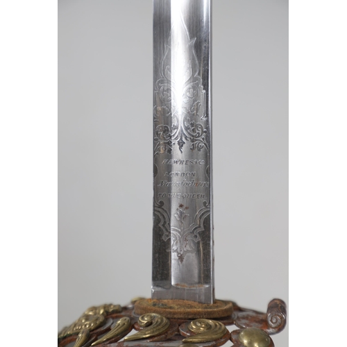 89 - A VICTORIAN 1834/1874 PATTERN HOUSEHOLD CAVALRY OFFICER'S SWORD AND SCABBARD. With a 97cm broad, poi... 