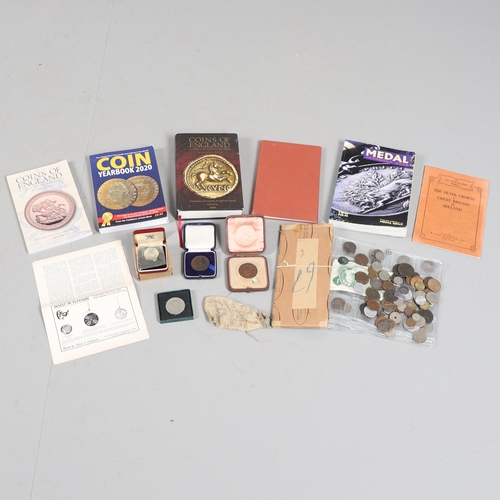 1081 - A MIXED COLLECTION OF COINS, BOOKS AND OTHER ITEMS. A mixed collection of pre decimal coins, a gymna... 