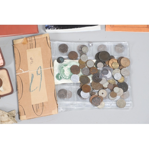 1081 - A MIXED COLLECTION OF COINS, BOOKS AND OTHER ITEMS. A mixed collection of pre decimal coins, a gymna... 