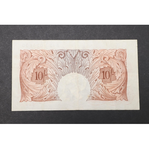 590 - A BANK OF ENGLAND SERIES A TEN SHILLING BANKNOTE. A series 'A' Britannia issue ten shilling banknote... 