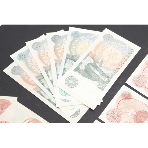 607 - A COLLECTION OF BANK OF ENGLAND ONE POUND AND TEN SHILLING NOTES. A collection of notes comprising s... 