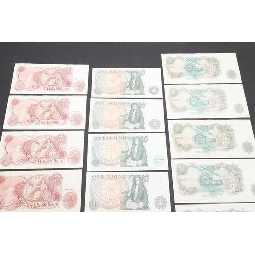 607 - A COLLECTION OF BANK OF ENGLAND ONE POUND AND TEN SHILLING NOTES. A collection of notes comprising s... 