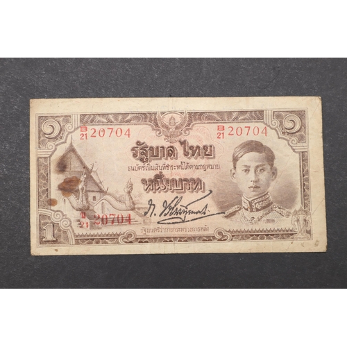 616 - A SECOND WORLD WAR THAILAND 1 BAHT BANKNOTE WITH INSCRIPTION. A Thailand 1 Baht note, 1942-1944. B21... 