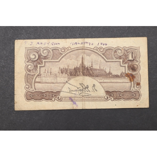 616 - A SECOND WORLD WAR THAILAND 1 BAHT BANKNOTE WITH INSCRIPTION. A Thailand 1 Baht note, 1942-1944. B21... 