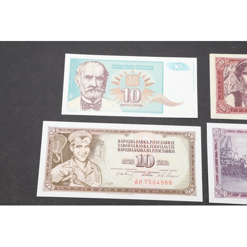 619 - A COLLECTION OF EIGHT YUGOSLAVIAN BANKNOTES. A collection of Yugoslavian banknotes from 100000, 5000... 