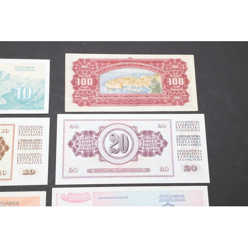 619 - A COLLECTION OF EIGHT YUGOSLAVIAN BANKNOTES. A collection of Yugoslavian banknotes from 100000, 5000... 