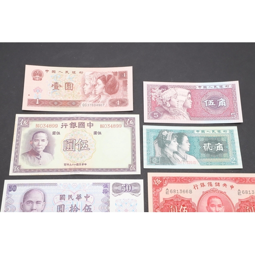 621 - A COLLECTION OF JAPANESE AND CHINESE BANKNOTES. A collection of ten banknotes including a Japanese G... 