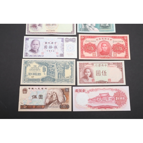 621 - A COLLECTION OF JAPANESE AND CHINESE BANKNOTES. A collection of ten banknotes including a Japanese G... 