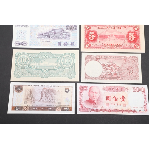 621 - A COLLECTION OF JAPANESE AND CHINESE BANKNOTES. A collection of ten banknotes including a Japanese G... 