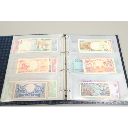 623 - AN ALBUM OF OVER 150 WORLD BANK NOTES TO INCLUDE INDONESIA, IRAQ, CAMBODIA, ISRAEL AND OTHER COUNTRI... 