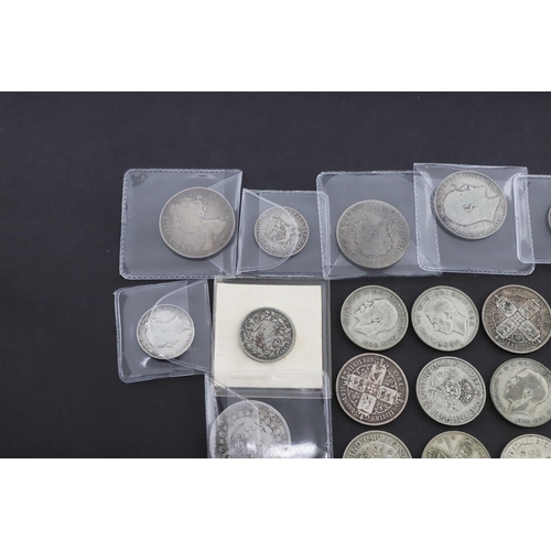 643 - A QUEEN ANNE HALF CROWN, 1708, AND A COLLECTION OF OTHER LATER SILVER COINS. A Queen Anne Halfcrown,... 