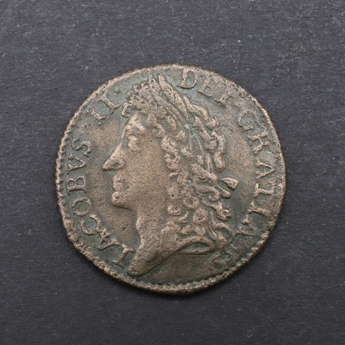 751 - A JAMES II GUNMONEY SHILLING, 1689. A James II Shilling, laureate head left, reverse with Crown over... 