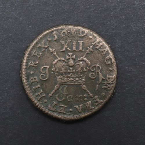 751 - A JAMES II GUNMONEY SHILLING, 1689. A James II Shilling, laureate head left, reverse with Crown over... 