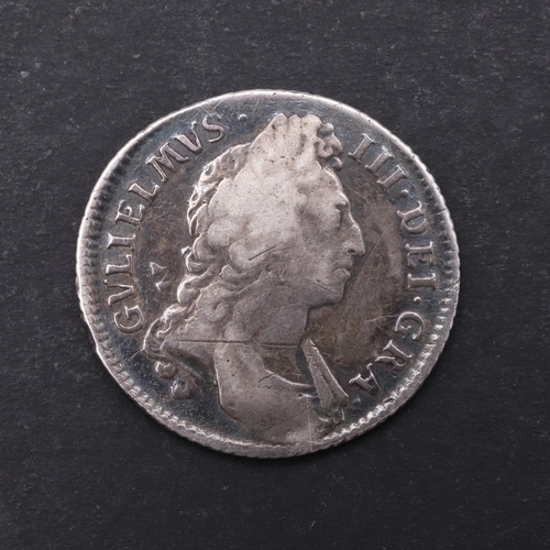 755 - A WILLIAM III SHILLING, 1696. A William III Shilling, first draped bust r. Reverse with crowned cruc... 