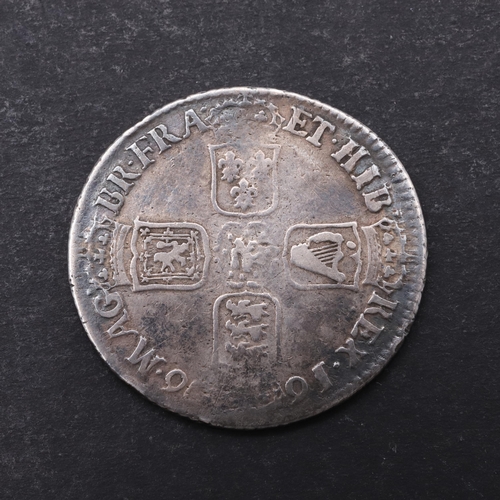 755 - A WILLIAM III SHILLING, 1696. A William III Shilling, first draped bust r. Reverse with crowned cruc... 