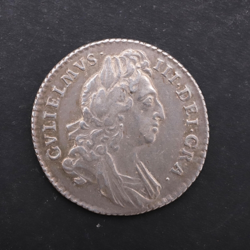 757 - A WILLIAM III SIXPENCE, 1697. A William III Sixpence, first laureate and draped bust r. Reverse with... 