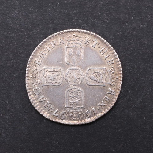 757 - A WILLIAM III SIXPENCE, 1697. A William III Sixpence, first laureate and draped bust r. Reverse with... 