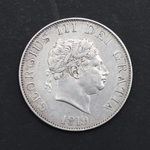 765 - A GEORGE III HALFCROWN, 1819. A George III Halfcrown, small laureate head r. dated 1819, reverse wit... 